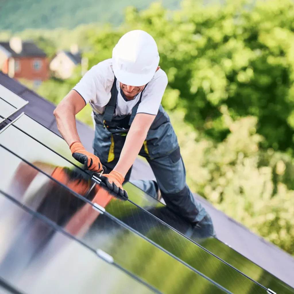 Man Installing or Repairing Black on Black Solar Panels on Roof
