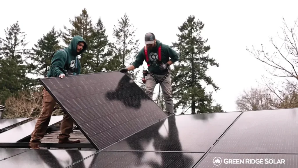 Solar professionals performing maintenance service and installation on solar panel system in Oregon.
