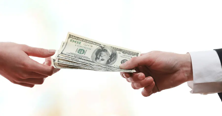 handing over money