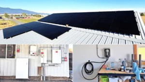 Rooftop solar panel system, battery backup, and EV charger installed on metal barn in rural Joseph, Oregon.